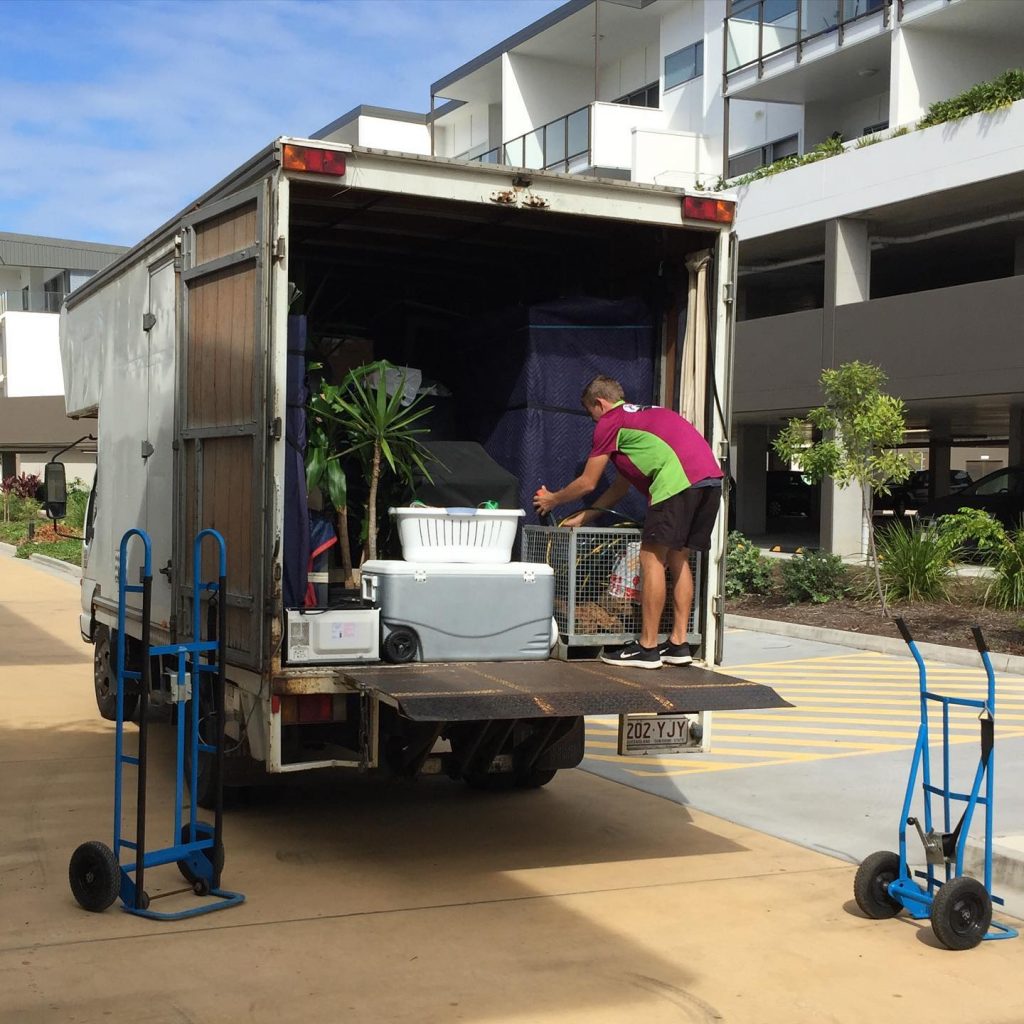 journey man workers loading a truck